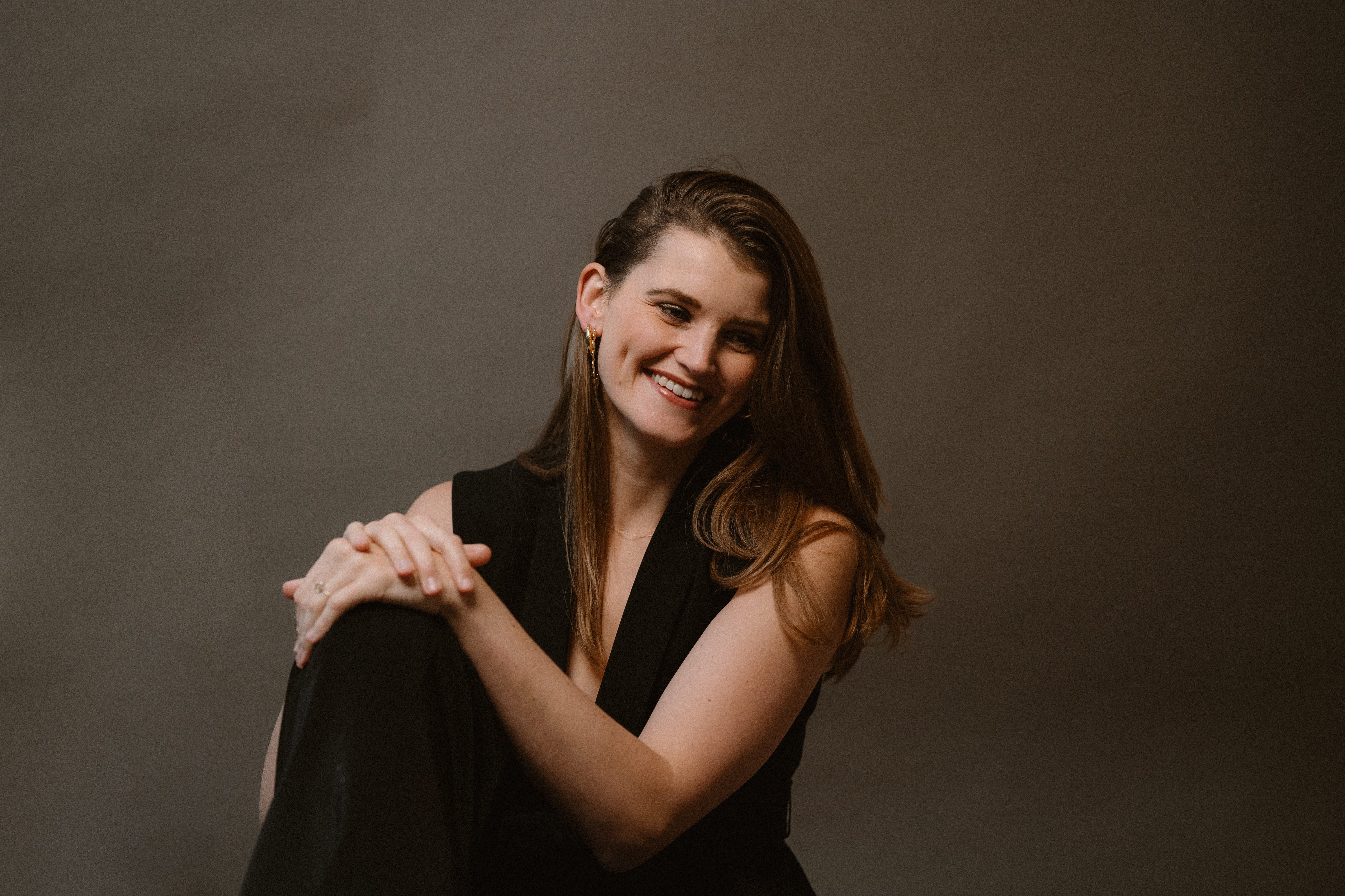 Fleur Bruin coach in black suit genuinely smiling