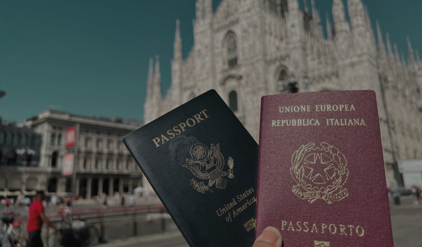 Picture of US and Italian passport in front of the Milan duomo