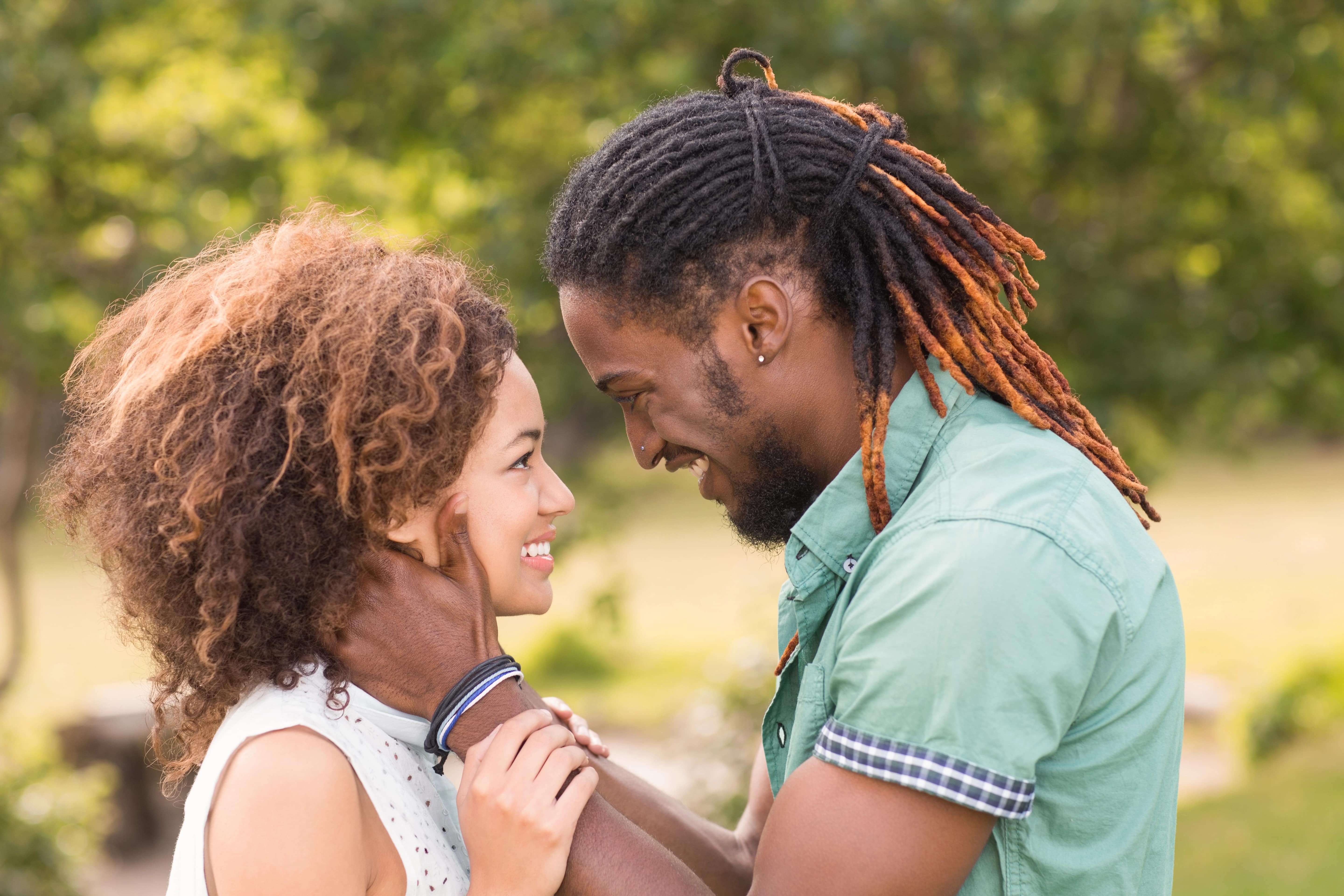 handsome mixed race couple smiling in love