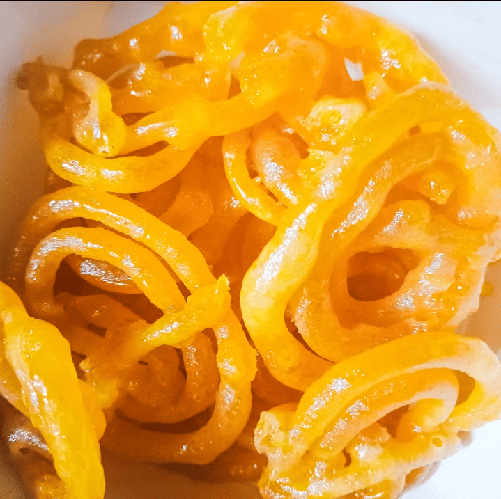Indian sweet snack food Jalebi on white background