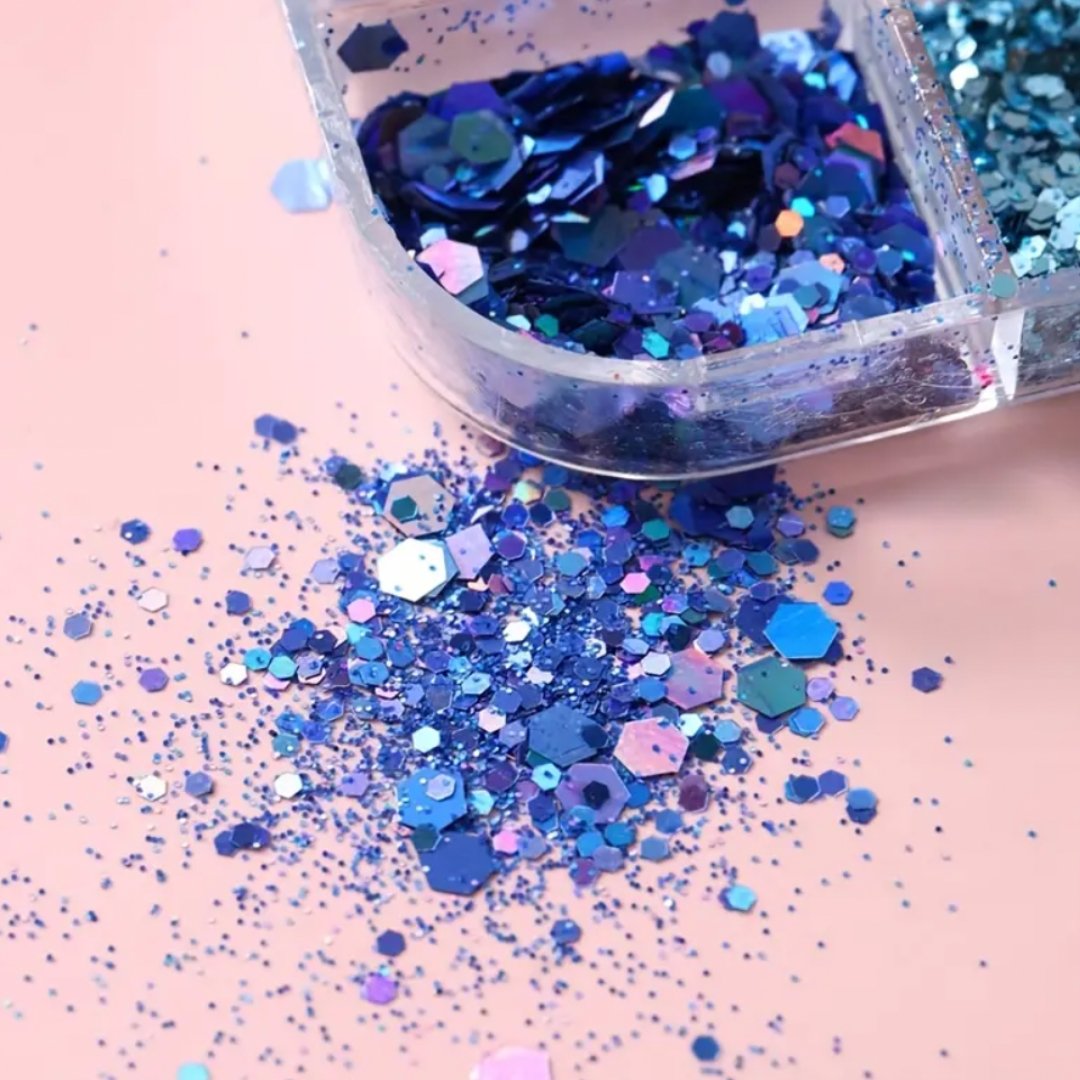 A collection of various blue glitters, including shades like Blue Teal, Cobalt Blue, and Electric Blue, perfect for adding sparkle to nail art.