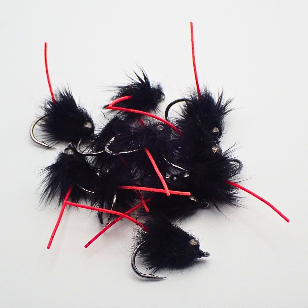 Small pile of Carp Vader Dark Hybrid carp flies with red tails, custom tied by Matt Campbell, The Fly Guy.