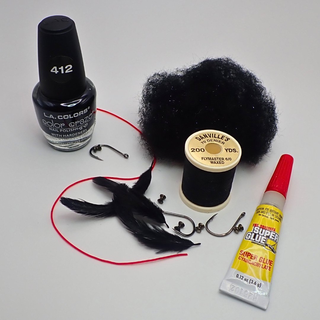 Black head cement, hooks, and materials used to tie the Carp Vader Dark Hybrid carp fly.