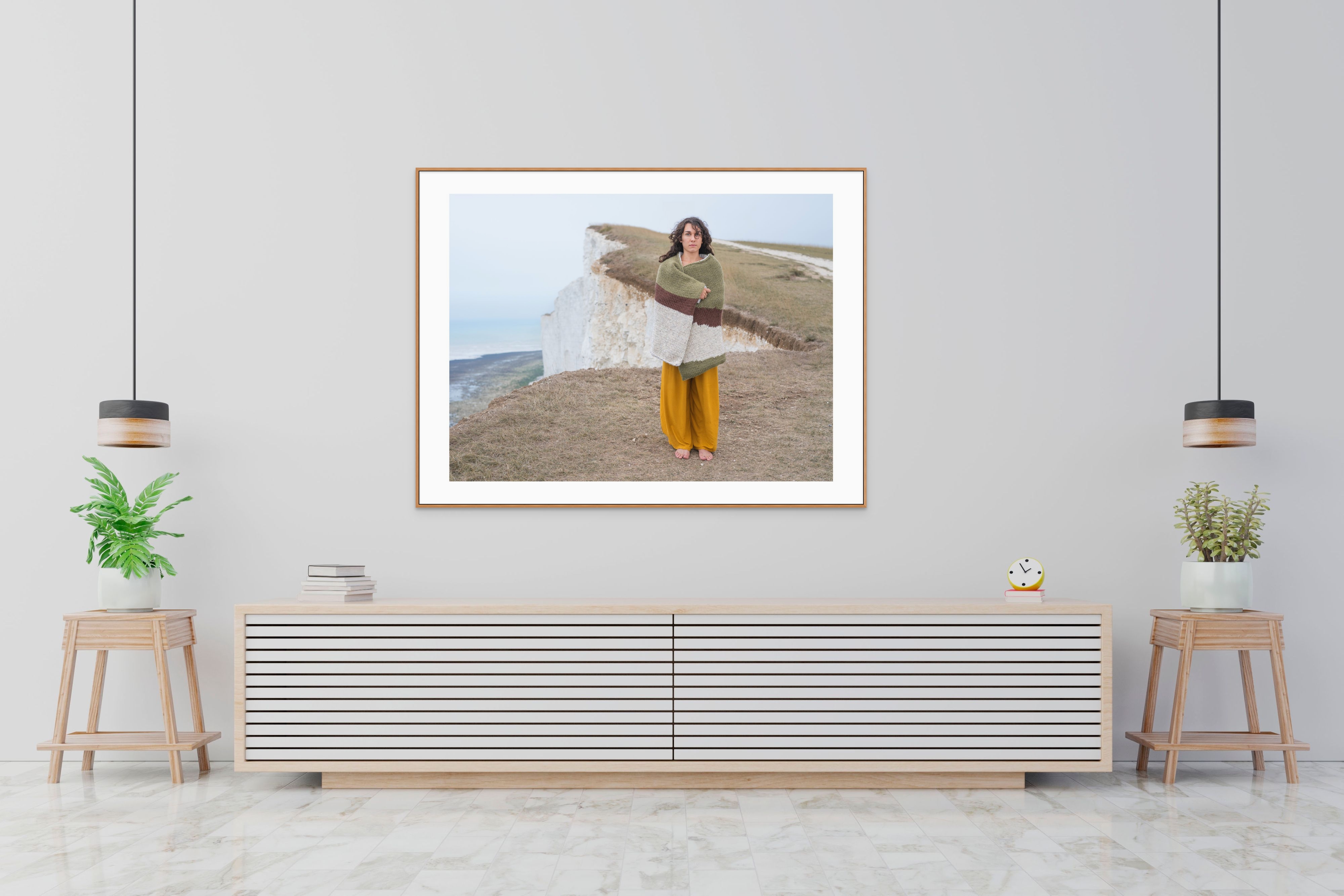 Limited edition prints from Joseph Ford and Nina Dodd’s Invisible Jumpers series - portrait of woman wearing custom camouflaged knitwear on cliffs near Beachy Head, UK