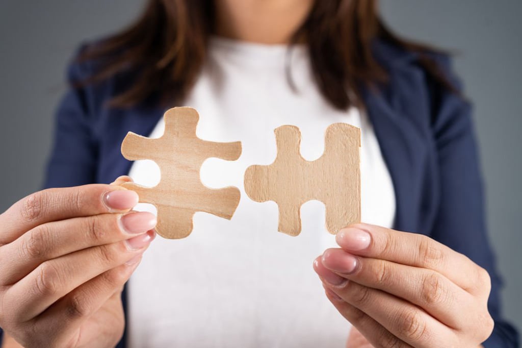 woman holding the missing puzzle pieces