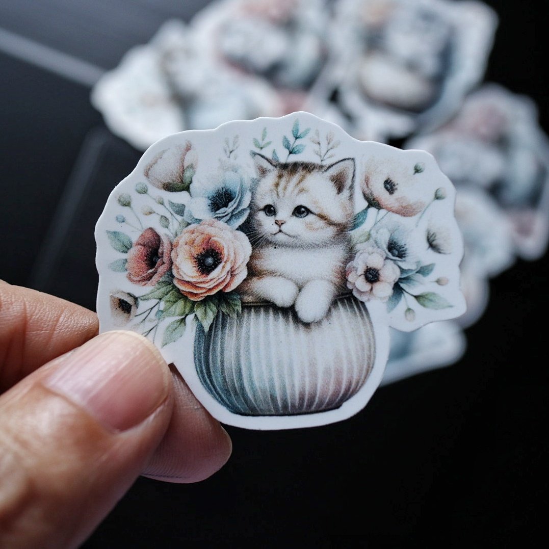 cat in a pot with florals element