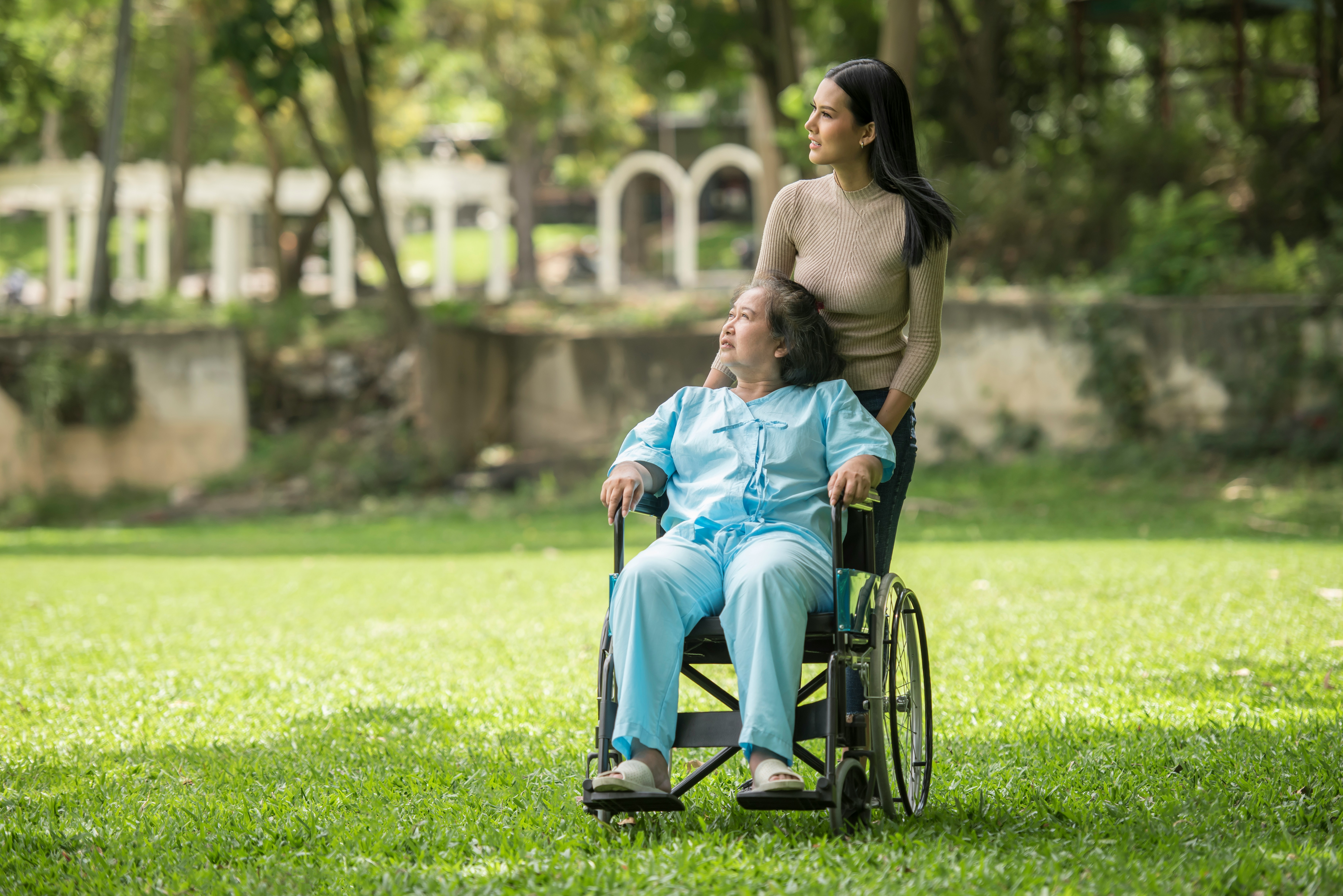 Caregiver with woman in wheelchair