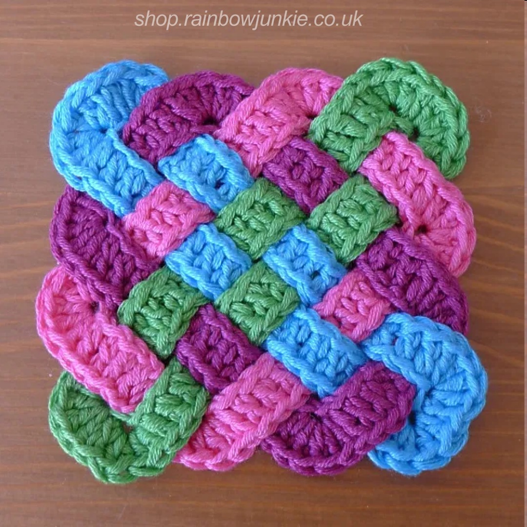 Four part Celtic plaitwork coaster in blue, dark red, pink and green.
