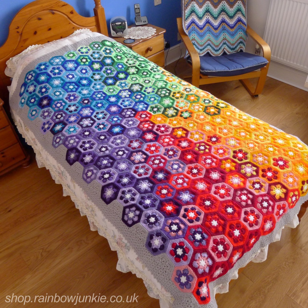 African Snow Flower Blanket on a single bed.