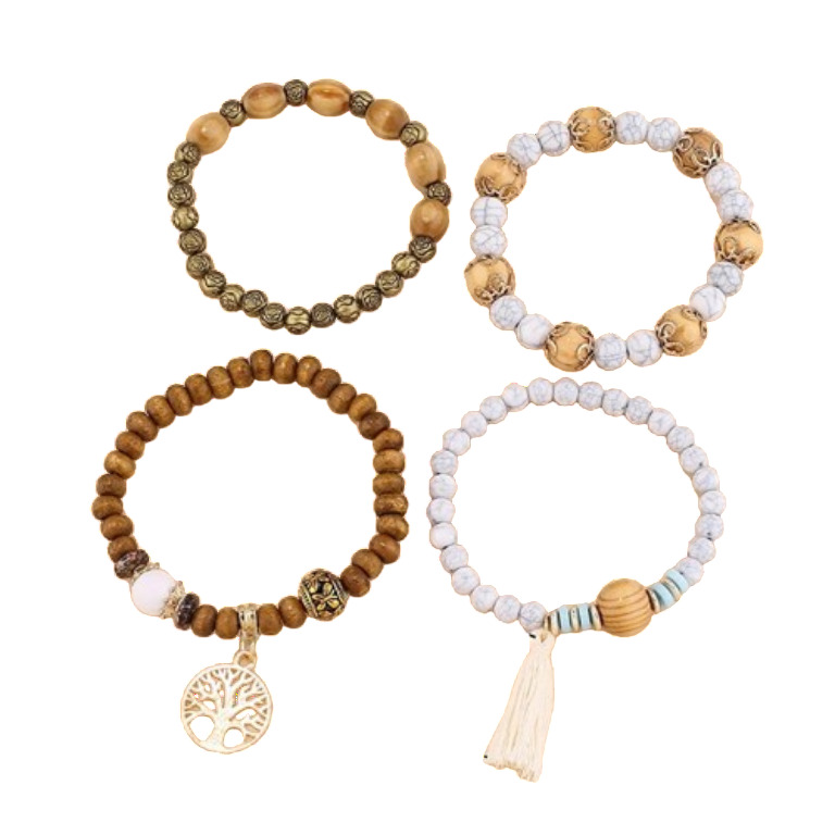 Set of four distinct ladies bohemian-style stretch bracelets, featuring: 1) Light brown oval wood beads alternating with ornate antique gold-tone metal beads. 2) White howlite-style stone beads alternating with carved light wood beads. 3) Medium brown ro