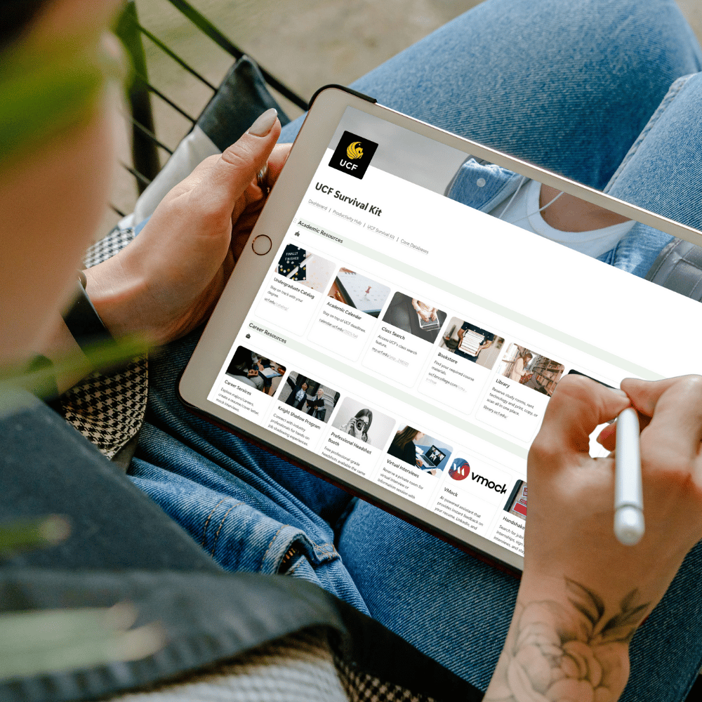 College student uses stylus to navigate UCF campus resources on their tablet.