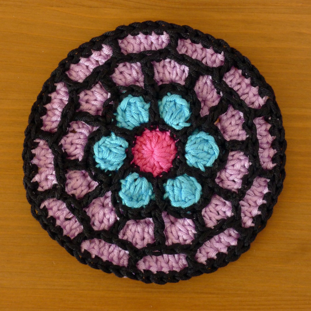 Rose Window Coaster in DK cotton yarn.
