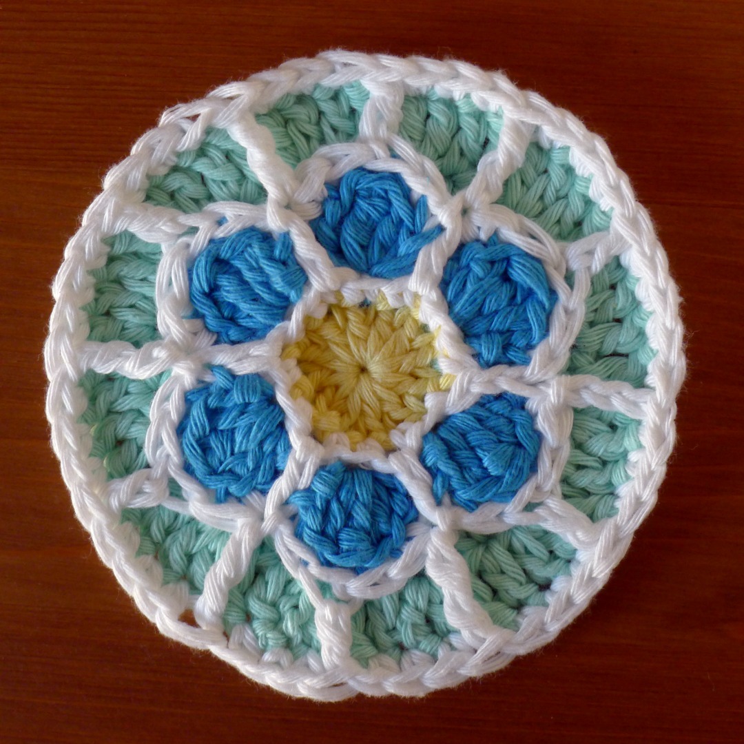Rose Window Coaster in Aran cotton yarn.