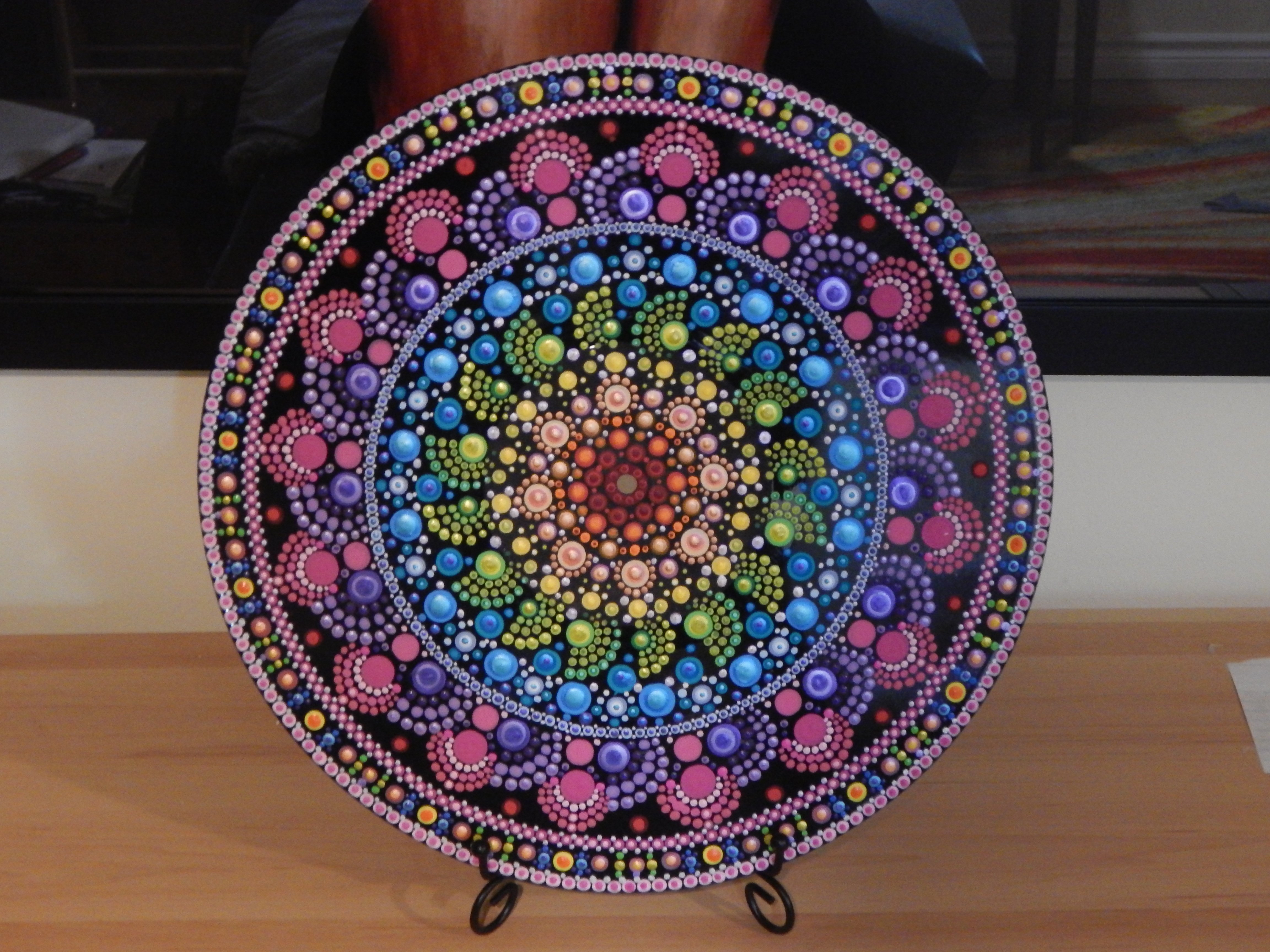 Upcycled vinyl record transformed into a vibrant dot mandala painting. This handmade piece blends color therapy with mindful art, turning musical history into a meditative, modern creation. Perfect for fans of upcycling, mandalas, and creative chaos.