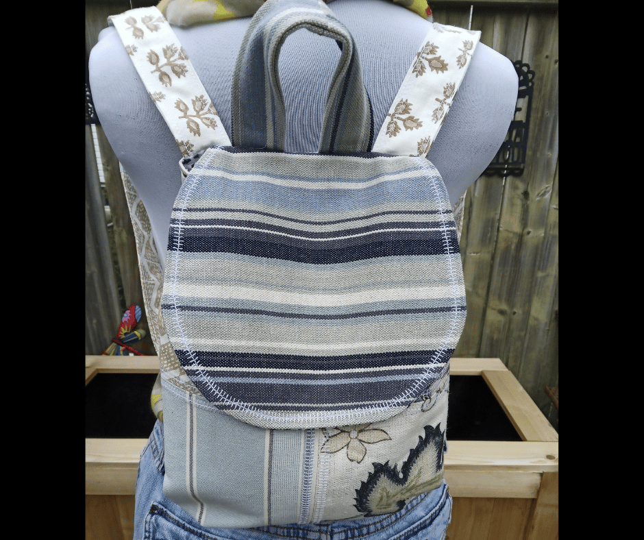 Upcycled patchwork tote bag crafted from blue-toned repurposed fabrics with a cozy cottagecore aesthetic. This handmade boho bag features layered textile textures, sustainable fashion elements, and artistic patchwork craftsmanship.