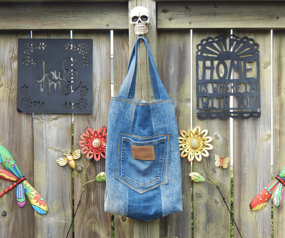 Handmade upcycled denim tote bag crafted from recycled blue jeans with patchwork detailing and layered denim textures. This large boho-style carryall from the Tote-ally Unhinged collection features sustainable sewing, repurposed textile artistry, and unique handmade character. Part of the Tote-ally Unhinged collection, this one-of-a-kind tote combines sustainable fashion, casual boho style, and durable handmade craftsmanship with layered denim textures and creative upcycled design.