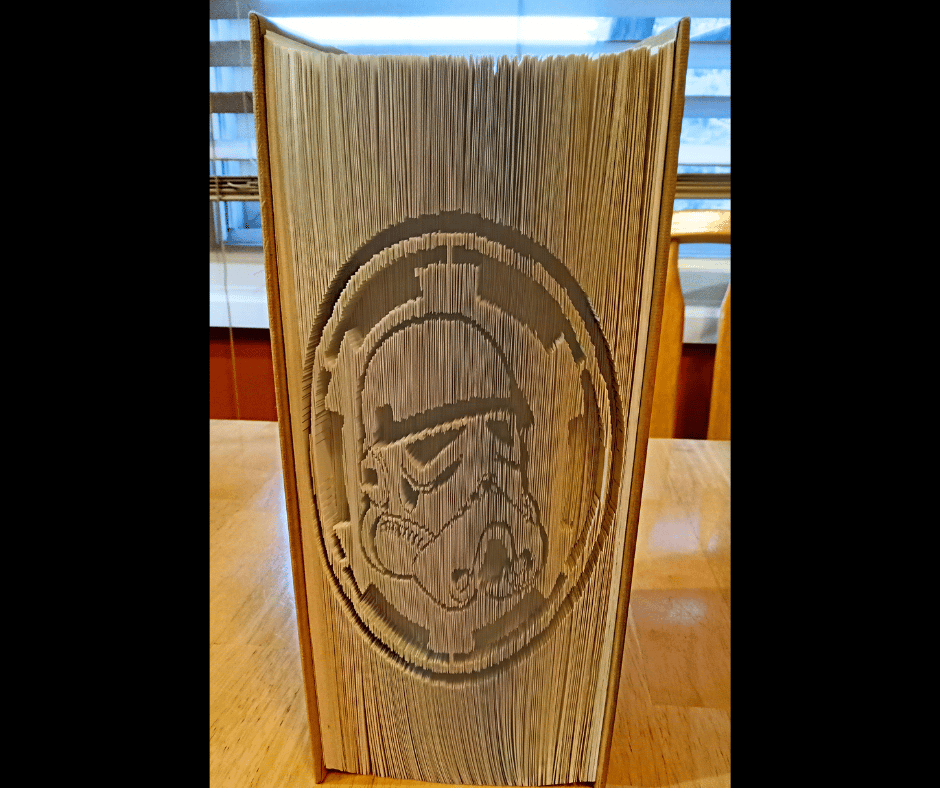 This Stormtrooper bookfold design transforms an old book into a striking 3D Star Wars sculpture. Perfect for fans of geeky crafts, upcycled art, and unique home decor. A fun and eco-friendly way to celebrate your love for Star Wars with handmade creativity.