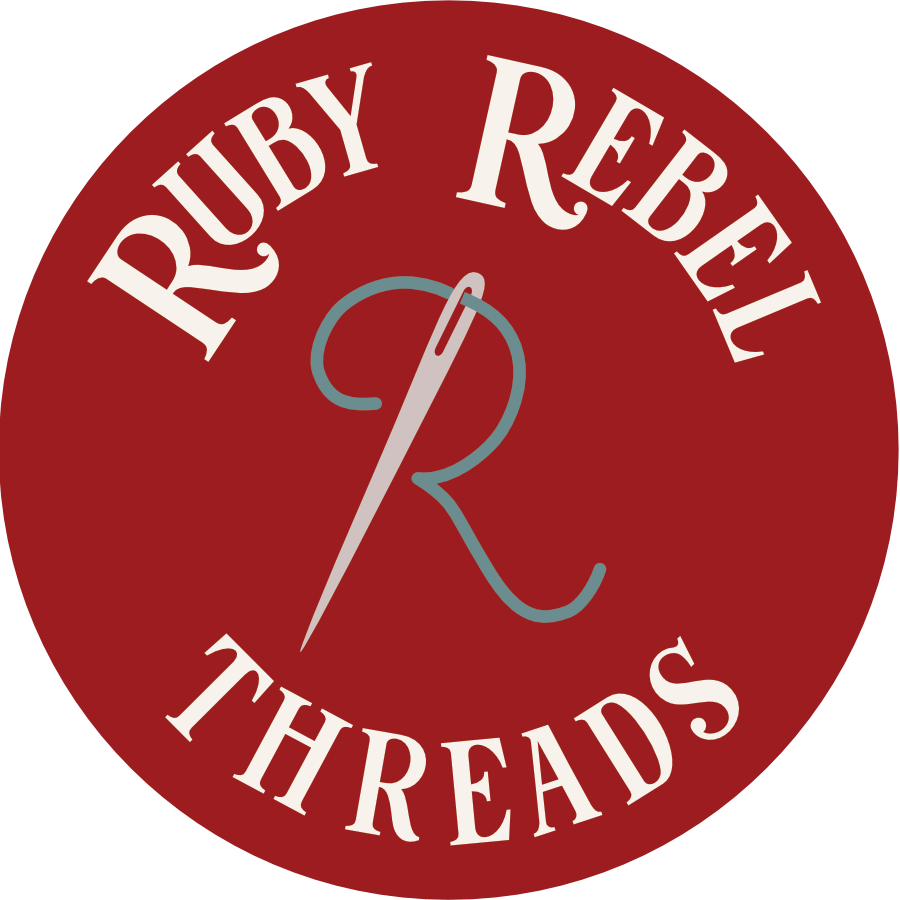 Ruby Rebel Threads Logo with needle and thread