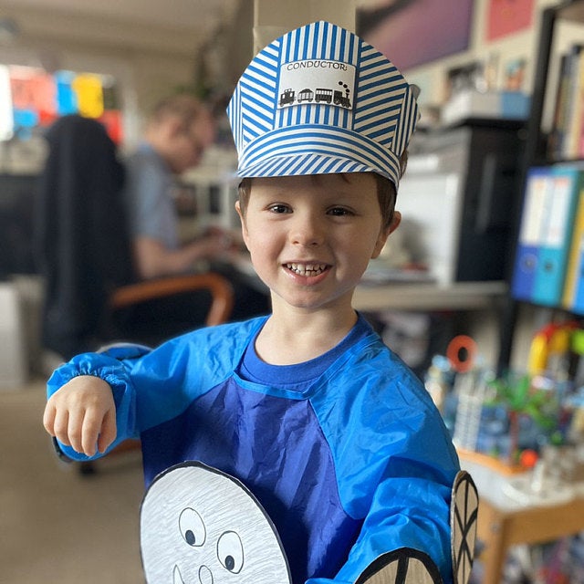 printable conductor hat modeled by a child in a homemade train costume
