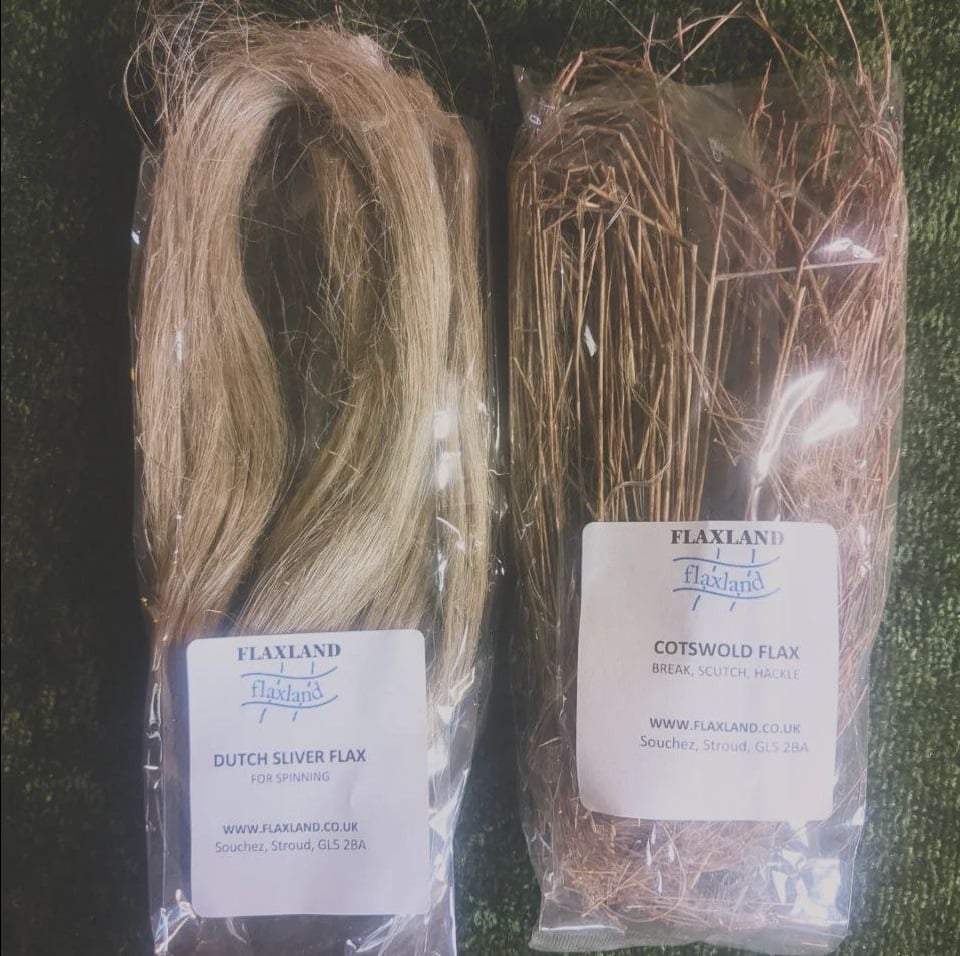 Two packets. One contains Dutch Sliver Flax fibres for spinning, the other contains Cotswold Flax straw for breaking, scutching and heckling. The flax fibre resembles thick blonde hair, and the unprocessed flax stems resemble dark brown straw.