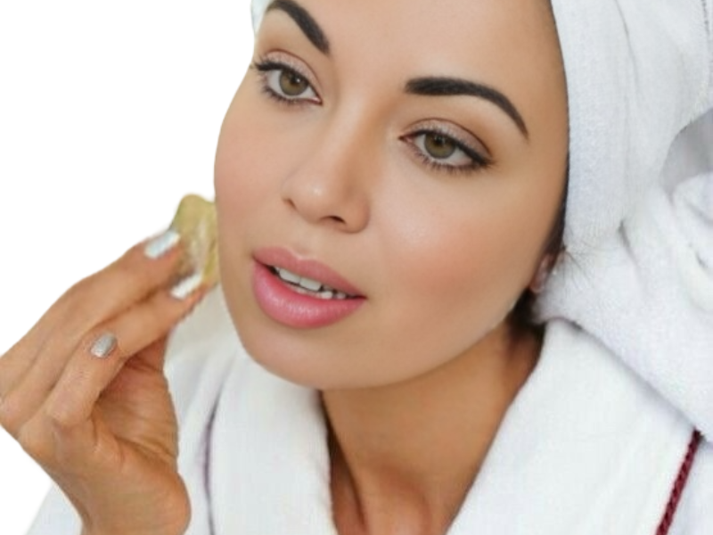 Woman using Gua Sha on the face.