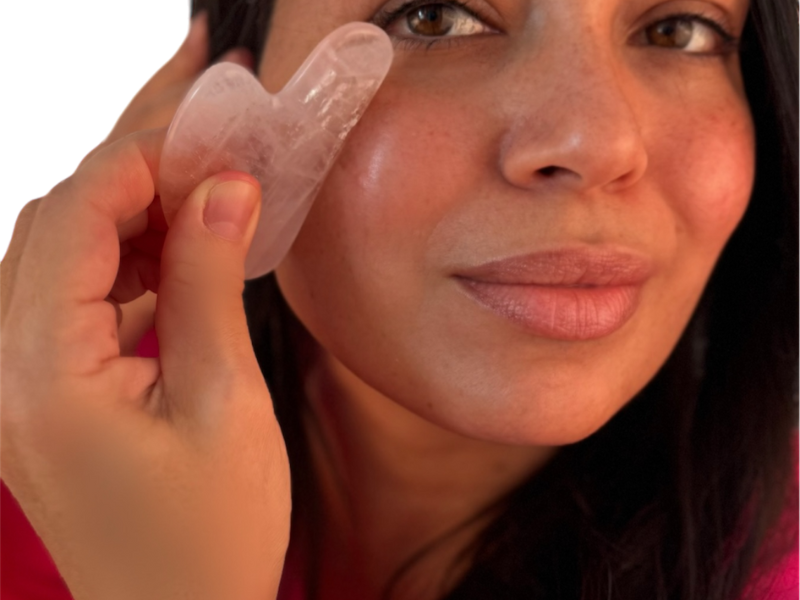 Woman performing Face Yoga to lift and firm sagging cheeks