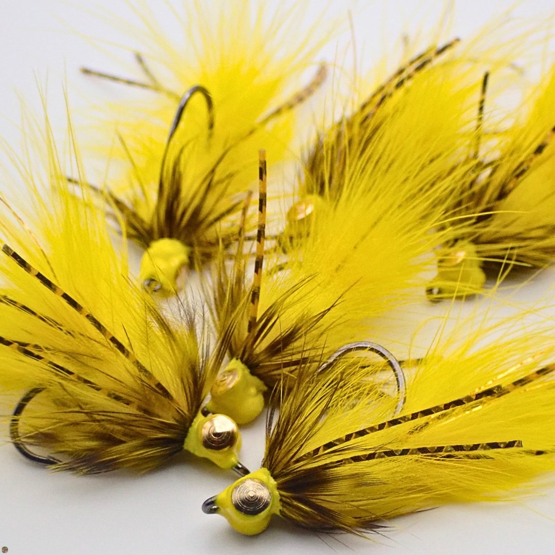 Close-up of yellow Creek Bugger Bass Version woolly bugger flies, custom tied by Matt Campbell, The Fly Guy.