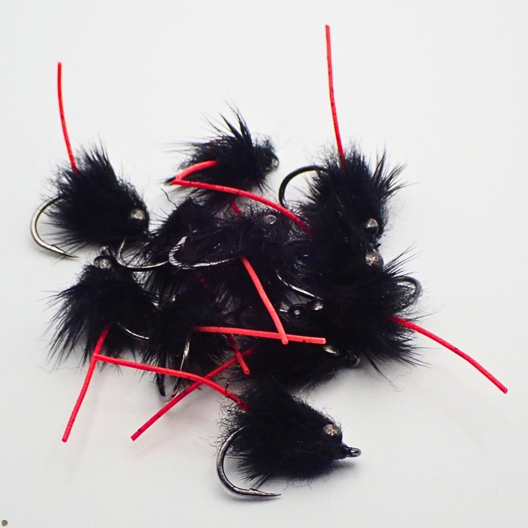 Small pile of Carp Vader Dark Hybrid carp flies with red tails, custom tied by Matt Campbell, The Fly Guy.