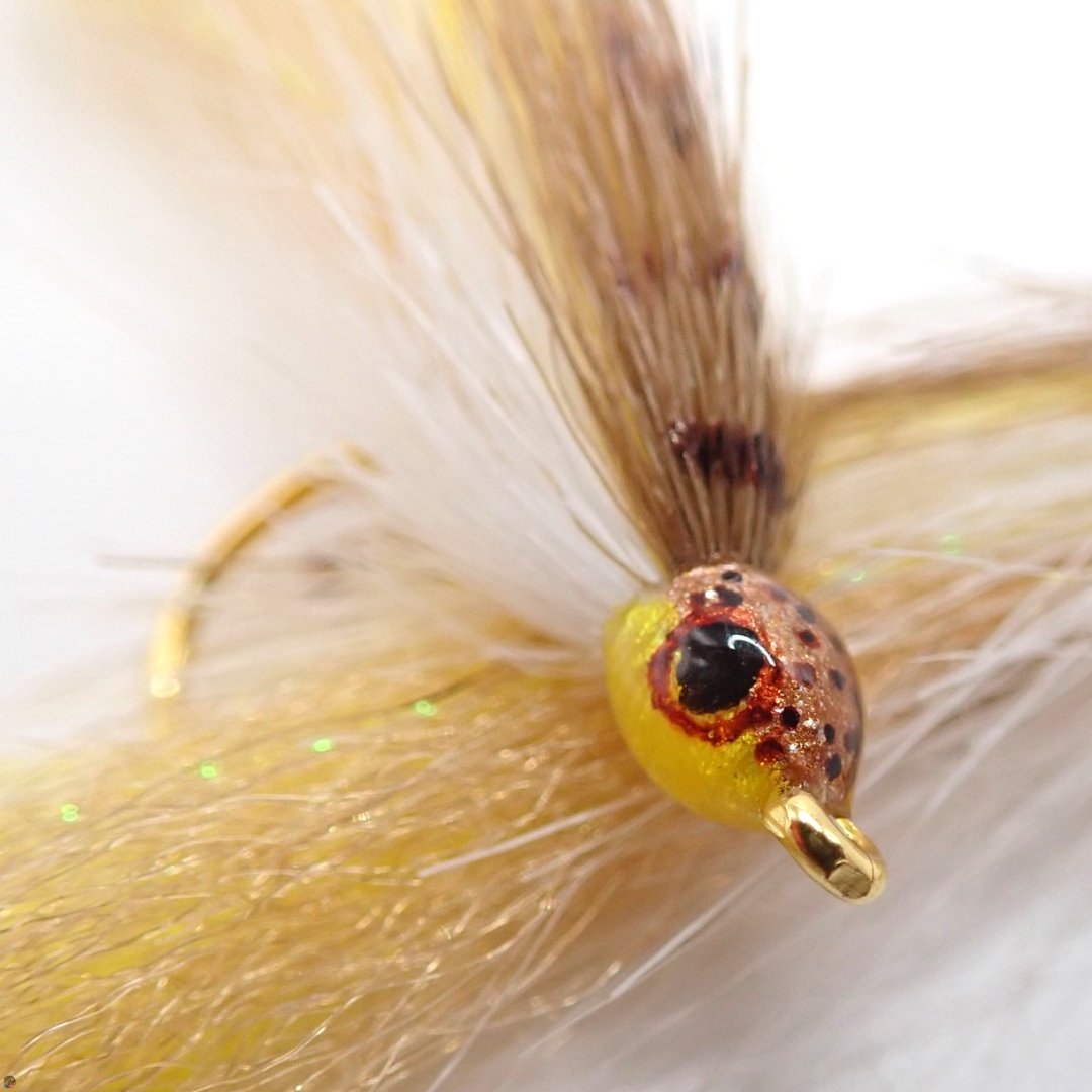 Close-up of Honey Brown Ice Minnow streamer fly with hand-painted head, tied by The Fly Guy, Matt Campbell.