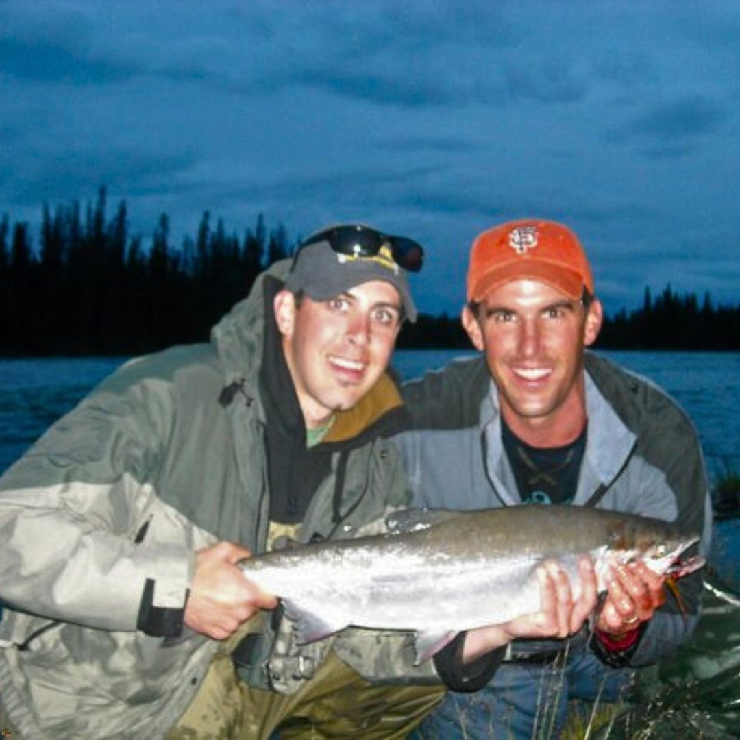 Happy client and guide Matt Campbell, The Fly Guy, holding a sockeye salmon on Alaska’s Kenai River.