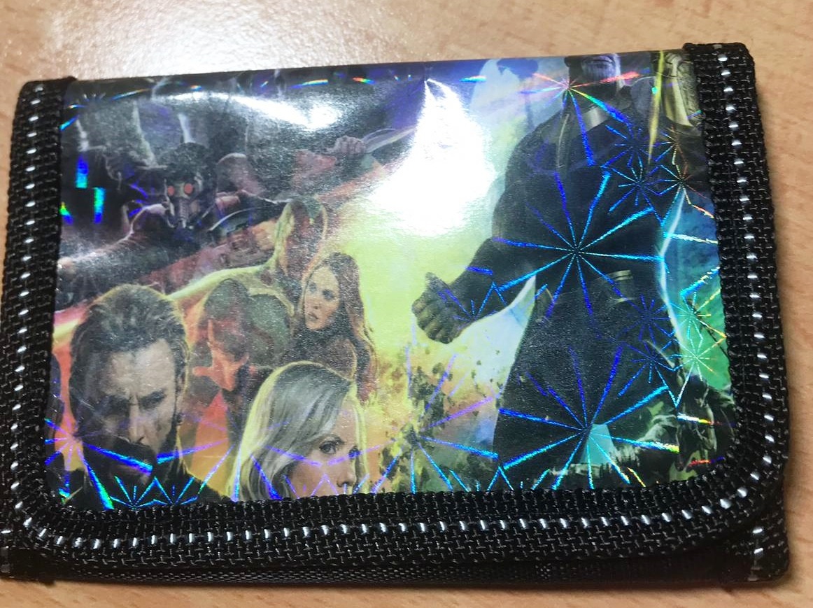 Durable trifold wallet for children featuring hero team graphics.