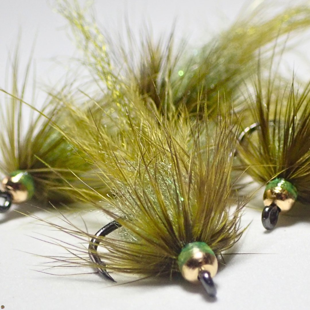 Close-up of a small pile of bead head Ice Leech trout flies tied by Matt Campbell, The Fly Guy.