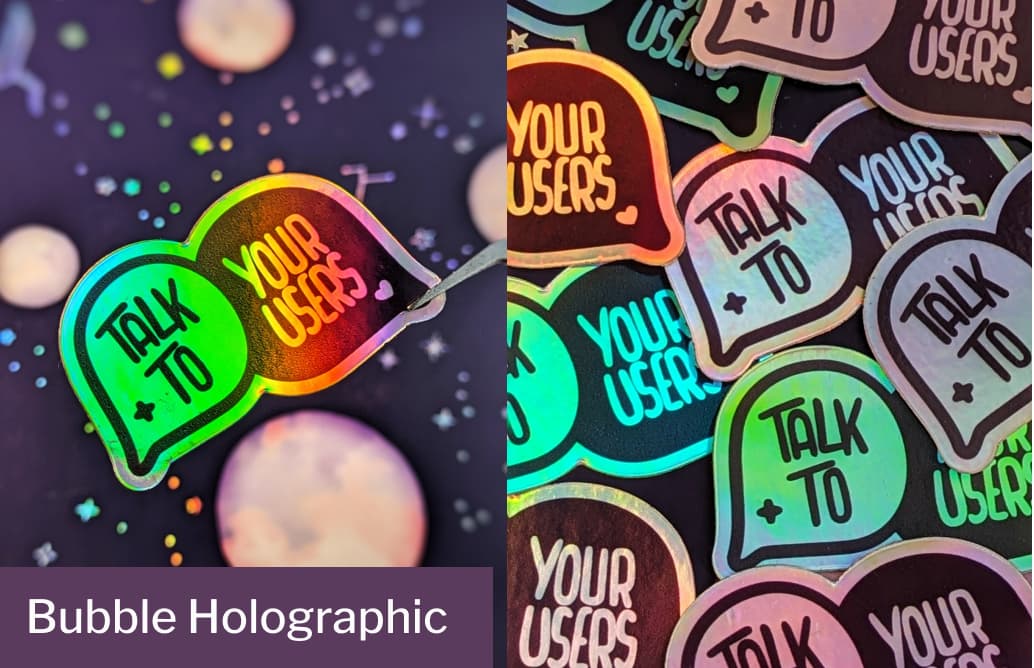 Holographic speech-bubble stickers reading Talk to your users in bright rainbow colors on a dark background.Tak to your users sticker: