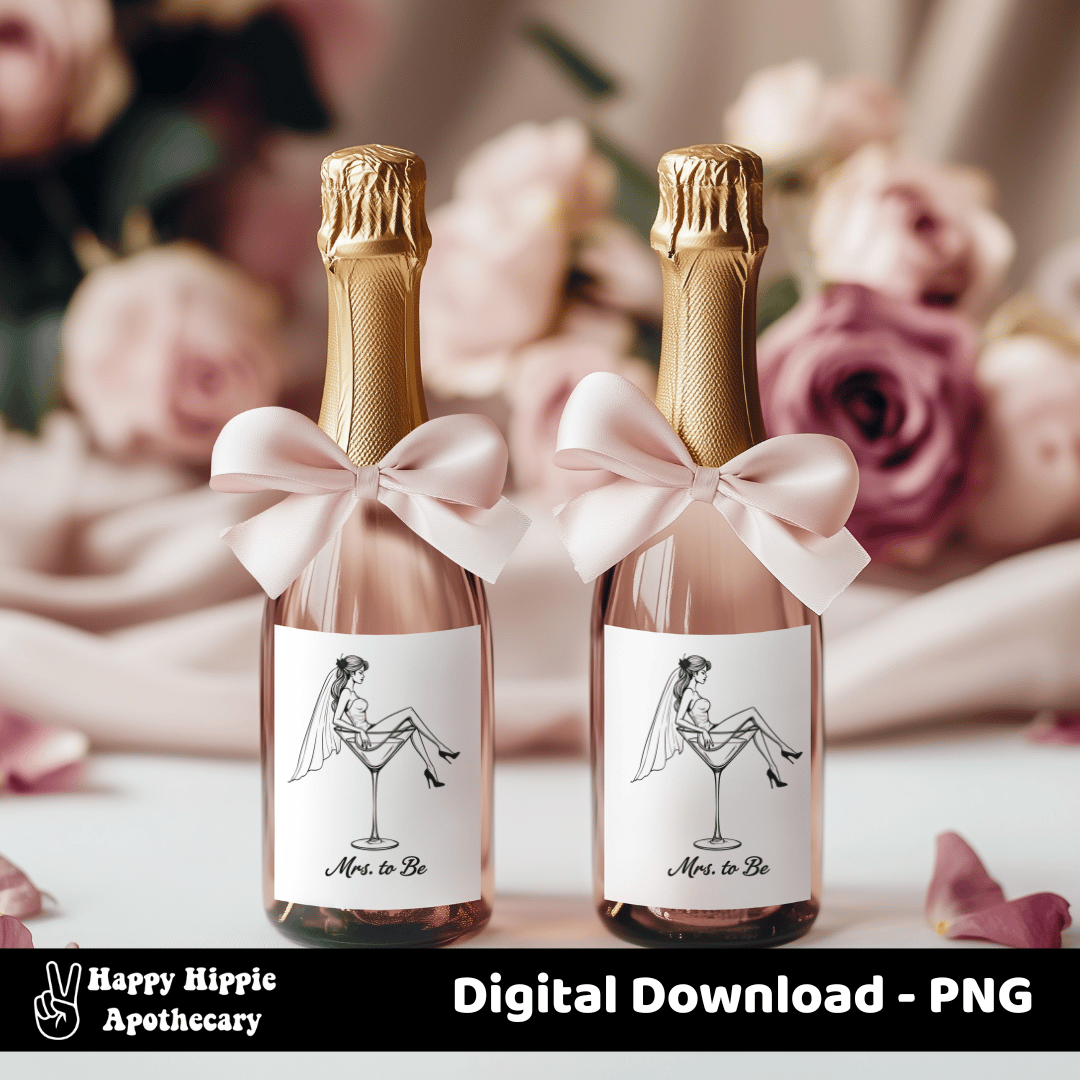 Mini champagne bottles with “Mrs. to Be” martini glass bride labels and pink bows, shown as elegant bridal shower or bachelorette party favors