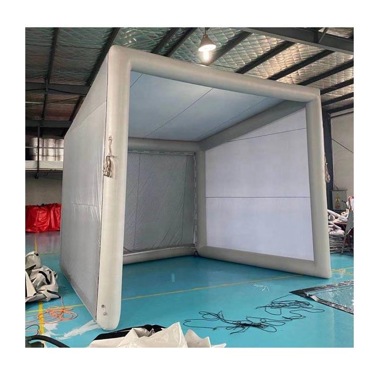 12x10ft inflatable golf simulator enclosure with impact screen set up in a garage