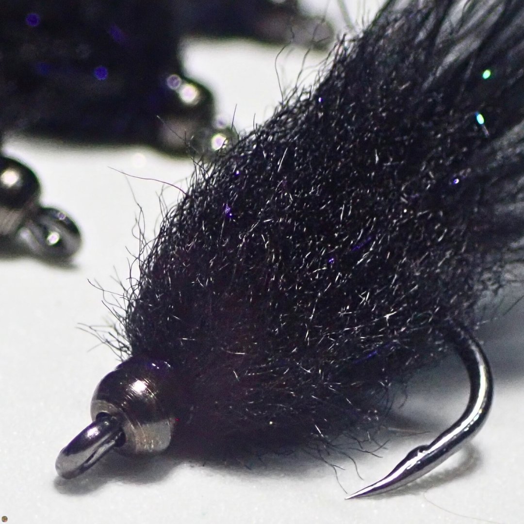 Black Mini Leech trout streamer fly, close-up view, tied by Matt Campbell.