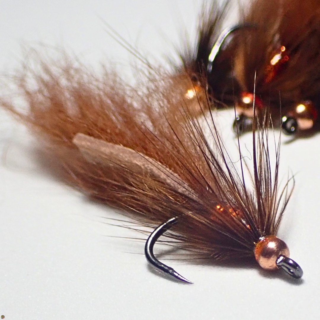 Close-up of a pile of Brown Mini Bunny Leech trout streamer flies tied by The Fly Guy, Matt Campbell.