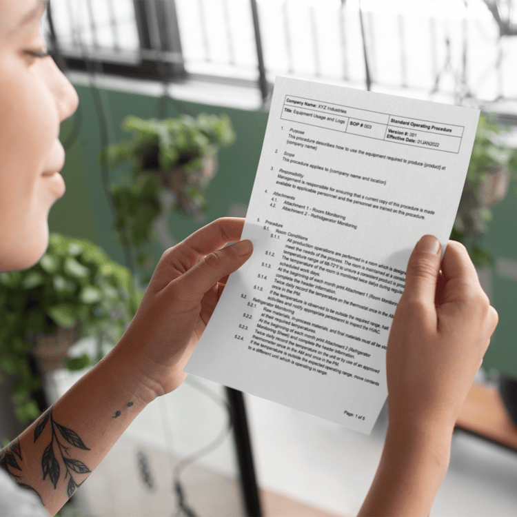 Employee reading a GMP document