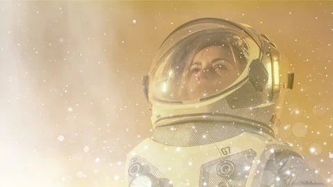 Astronaut against an orange background with particles in the foregroudn