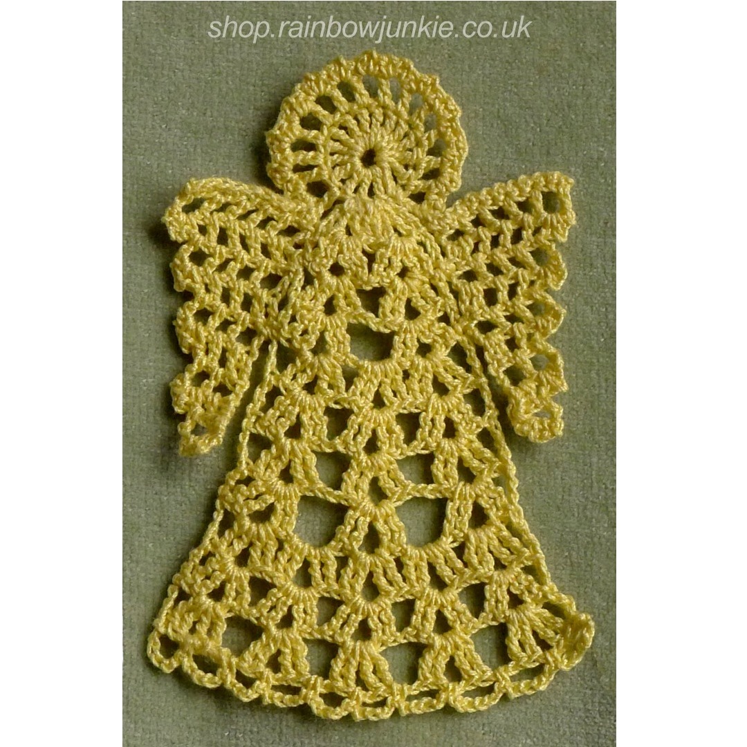 Angel bookmark made in yellow cotton on green background.