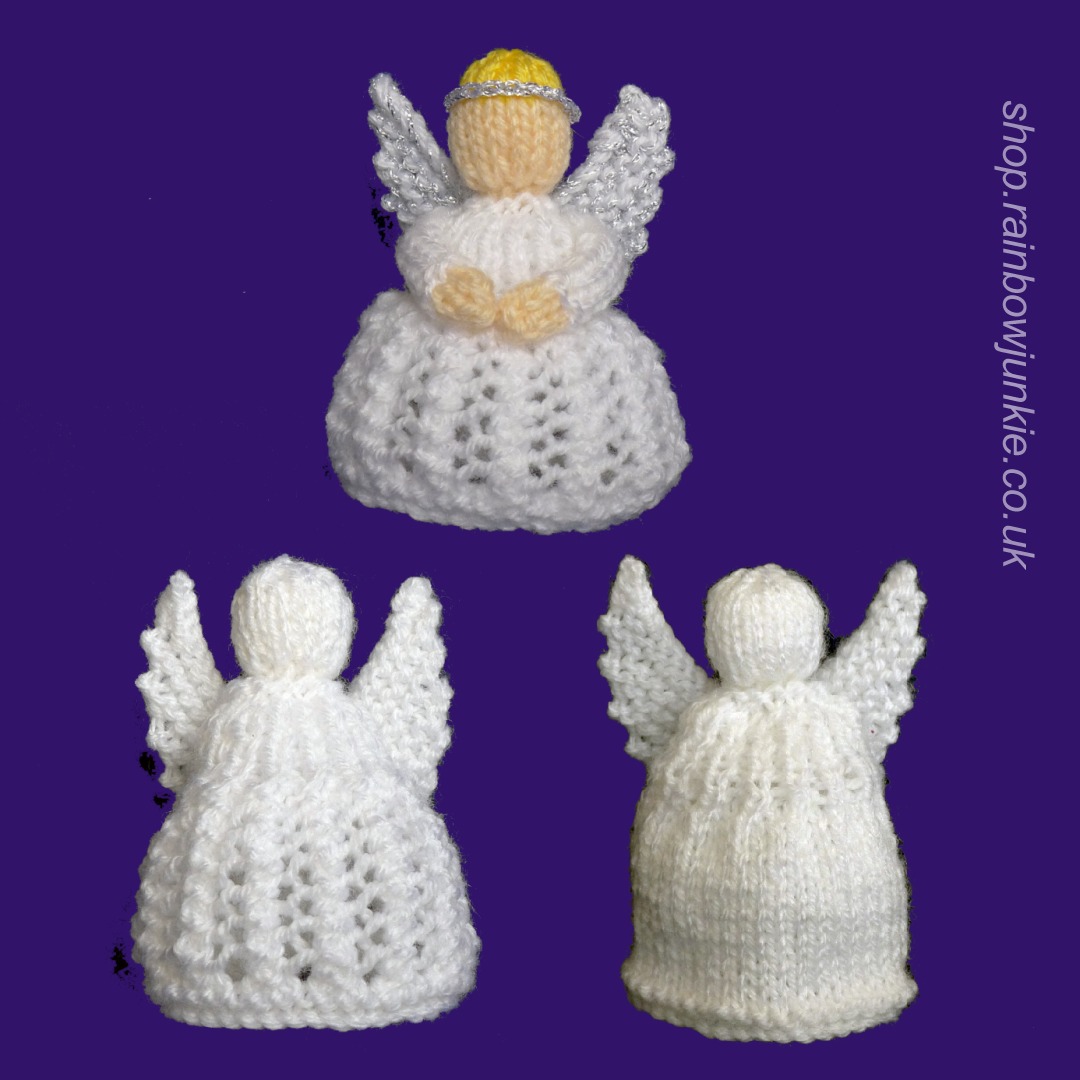 Three different angels in white. One has coloured head and hands. two different types of skirt.