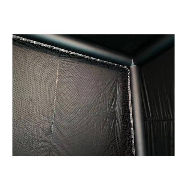 Portable golf simulator enclosure used outdoors in a backyard setting