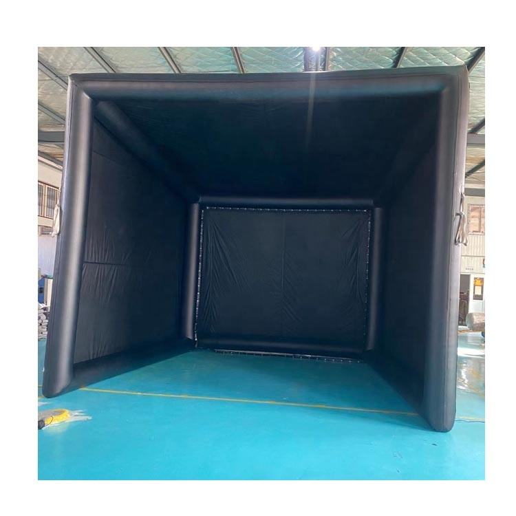 12x10ft inflatable golf simulator enclosure with impact screen set up in a garage