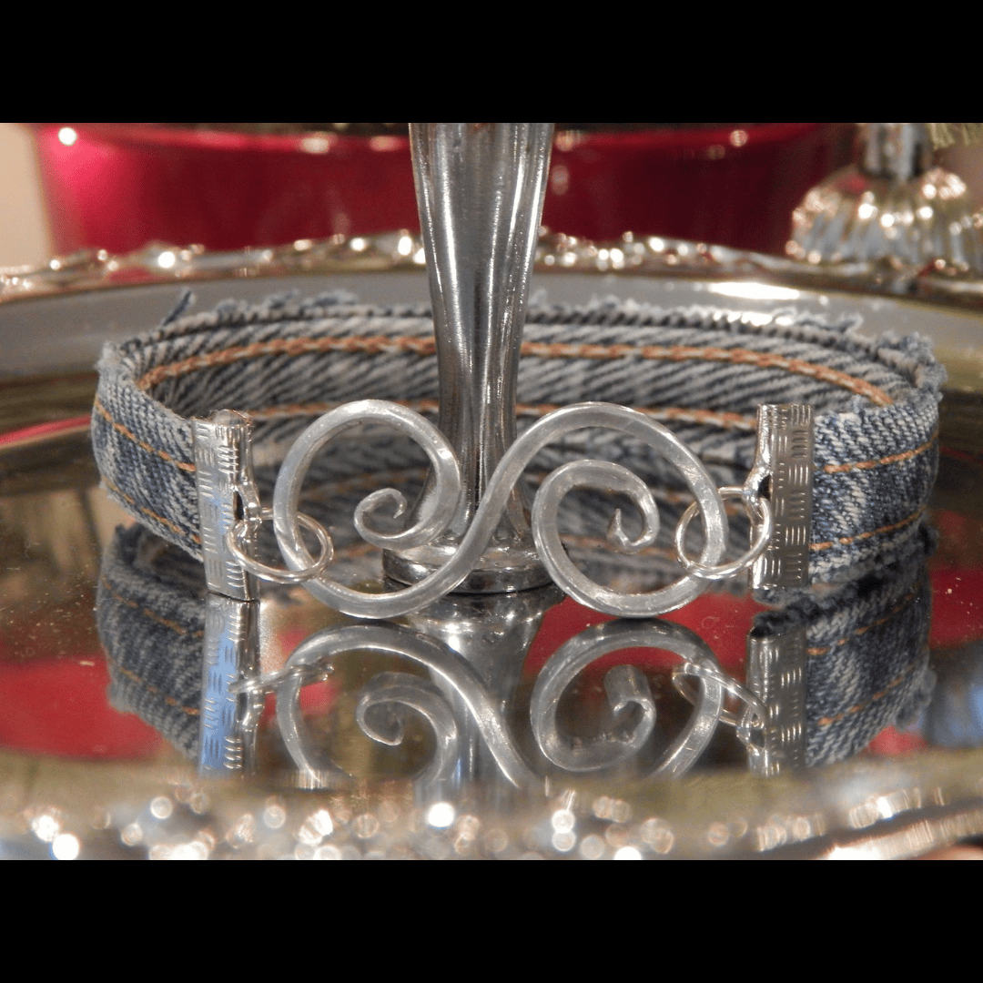 Handmade bracelet crafted from upcycled denim, joined with a custom wire clasp, featuring unique artisanal design by What in Narnation.