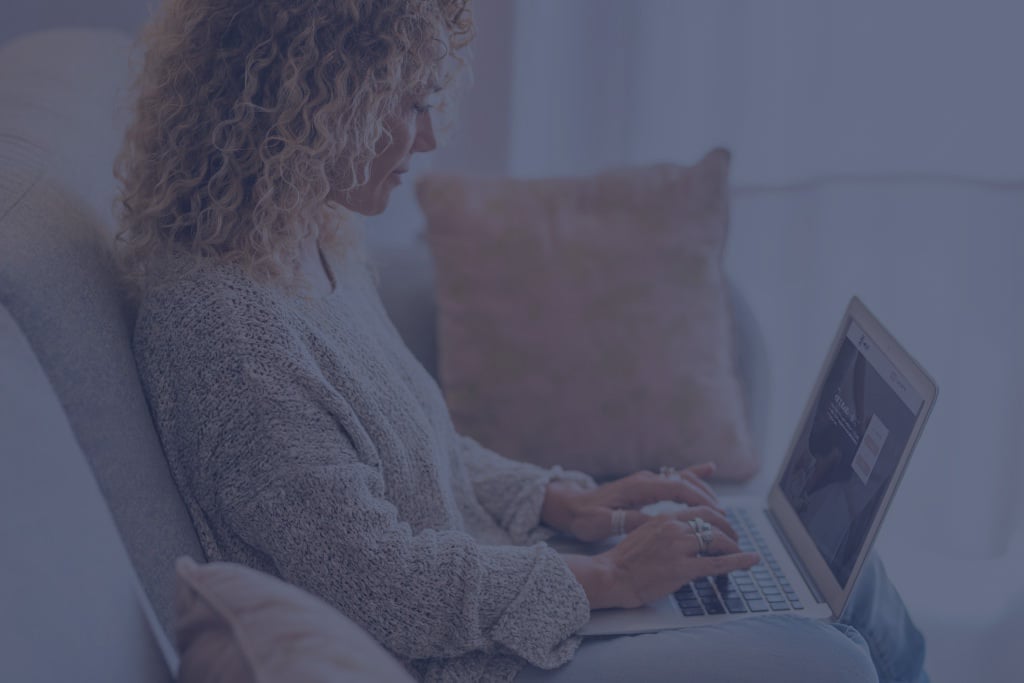 woman log in in to a coaching session