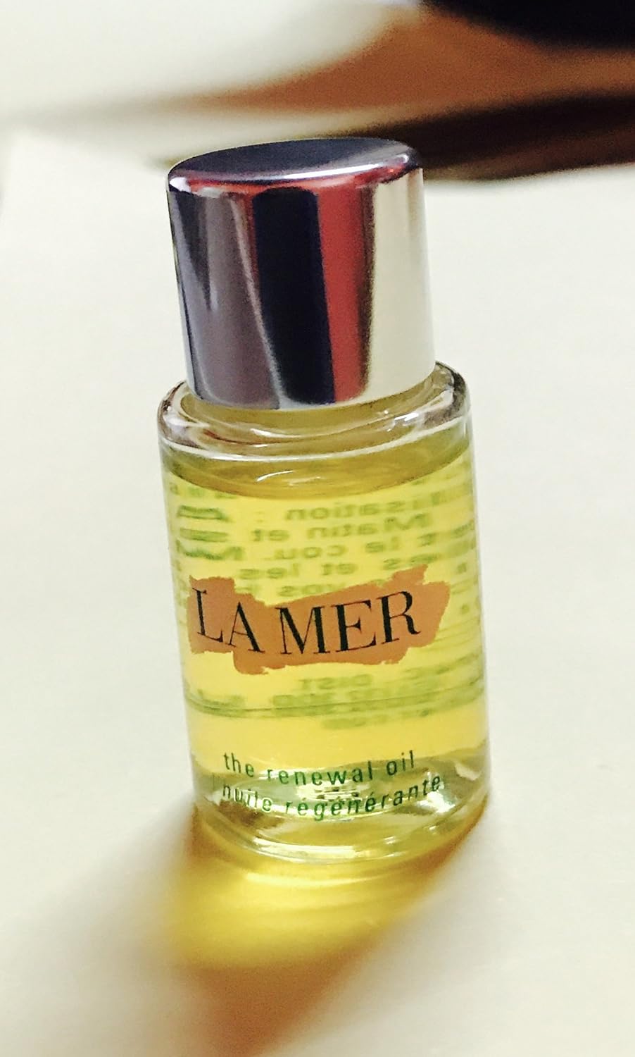 La Mer oil shimmering on arm