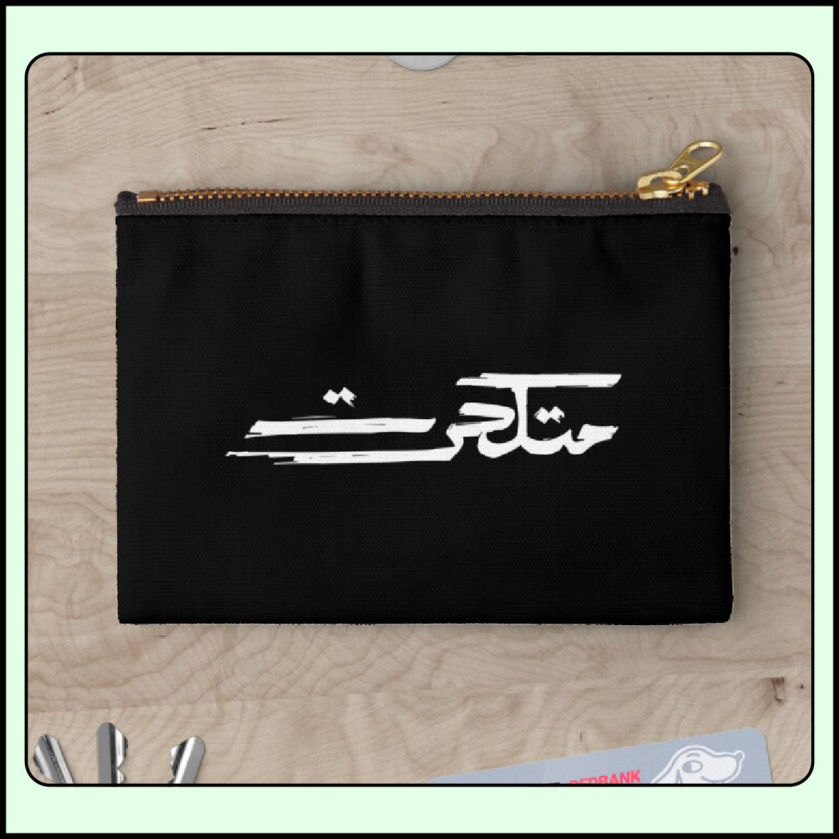 Metkahrat Arabic handwritten brush calligraphy on a zipper pouch mockup