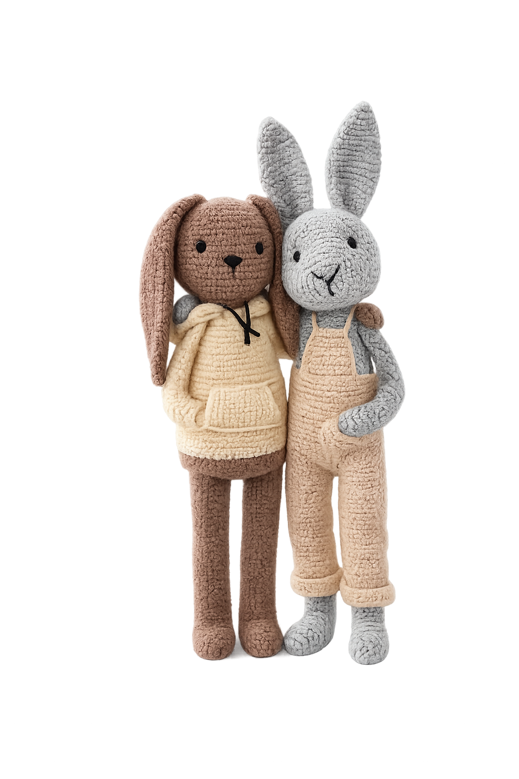 Two handmade crochet bunny dolls standing together, minimalist amigurumi rabbit design in neutral tones