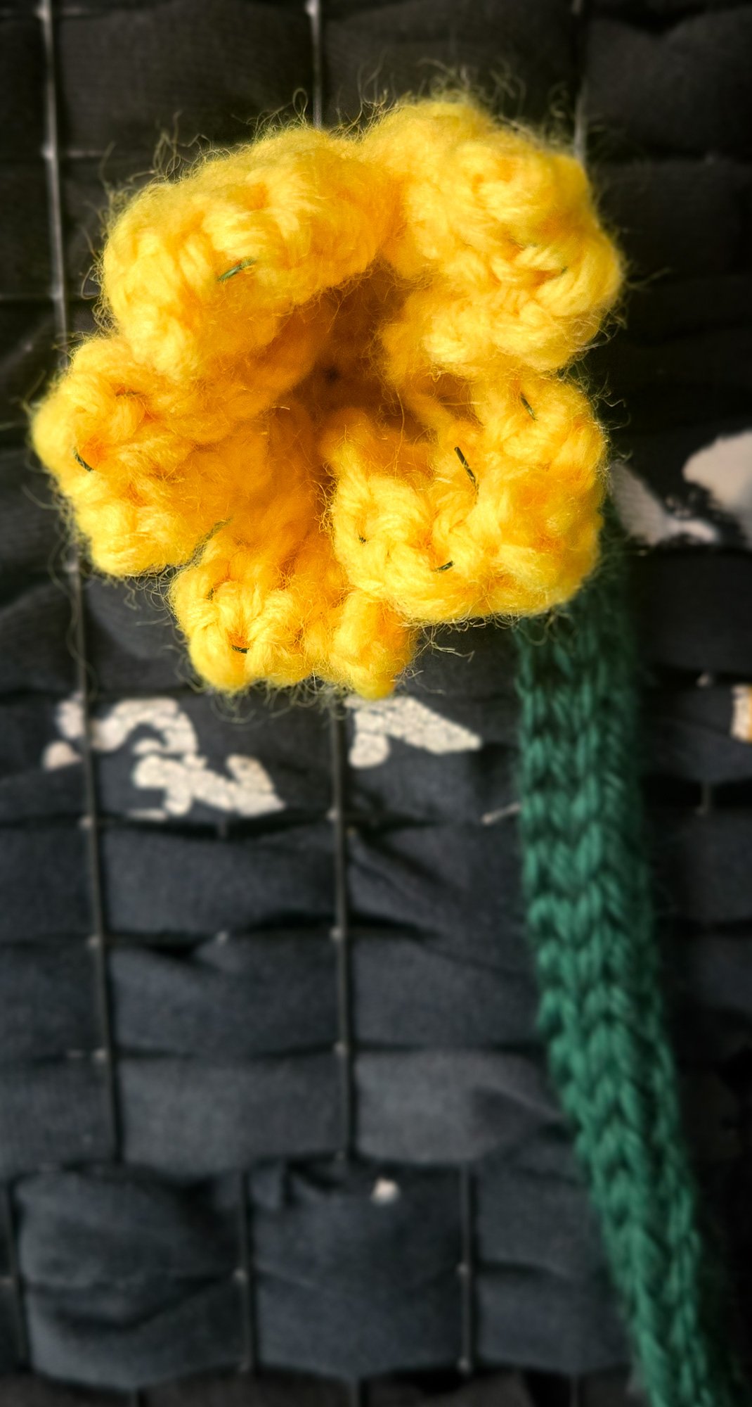 Close-up of a crochet cucumber flower showing petal texture and shaping from a crochet flower pattern.