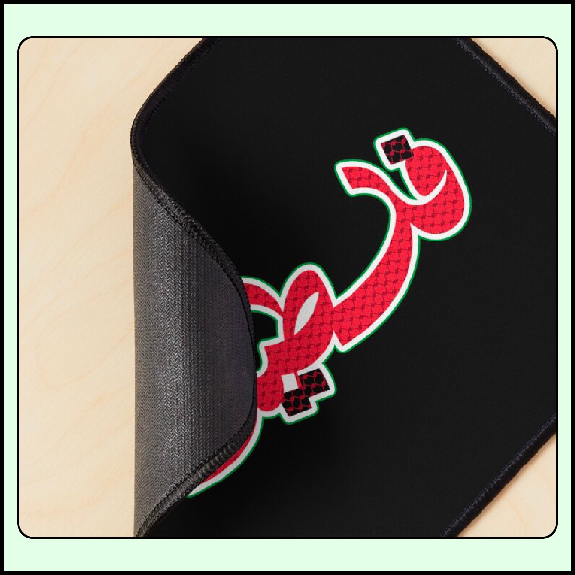 Heritage Arabic calligraphy design reading “Palestine” with kufiya pattern applied to a mouse pad mockup.